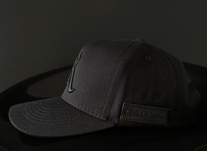 Gorra Royal Monarchy negra -logo negro